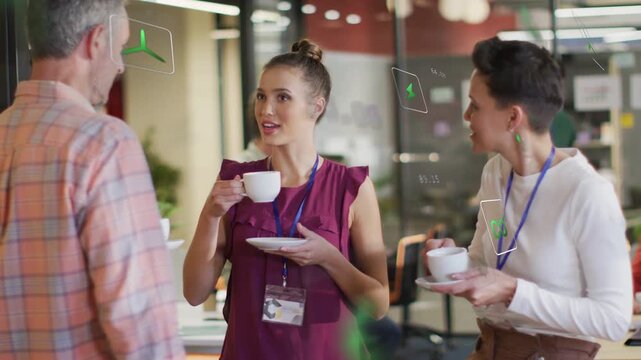 Vertical video: Colleagues in office, man initiating chat, central woman lowering cup, responding