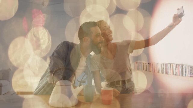 Flat design couple are taking selfie at table with smartphone, teapot, mugs, bokeh overlay