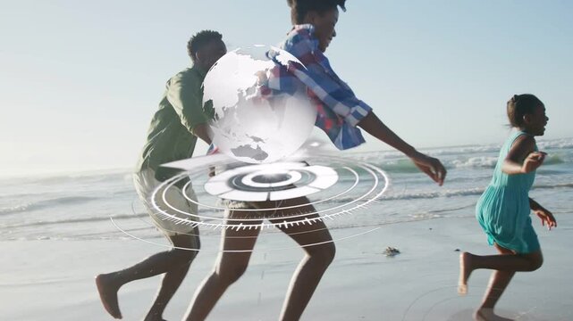 Vertical video: Family running right on sand for fun, AR demo showing 3D globe and rings overlaying