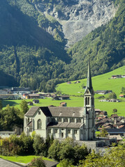 Fototapeta premium Alpine Church and Village of Lungern with Mountain Backdrop, Obwalden, Switzerland