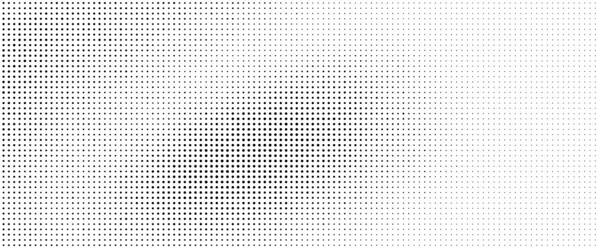 Halftone pattern with small black dots on a white background creating a gradient effect
