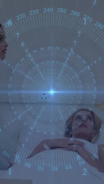 Masked medical provider leaning in from left, checking vitals on bed, blue HUD overlaying patient