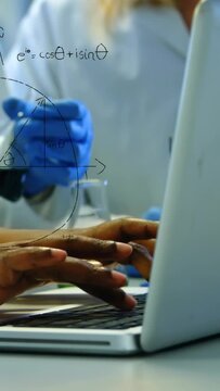 Vertical video: Hands typing lab laptop, gloved hand moving pipette causing Euler overlay for data