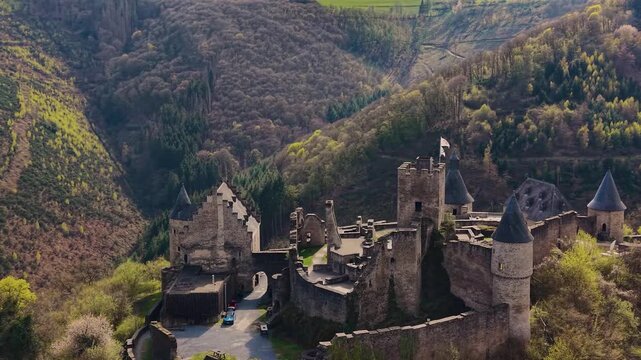 A panoramic Aerial view of the city and castle  Bourscheid in Luxembourg, on a sunny spring noon