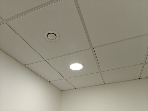 Exhaust ventilation in the ceiling part near a light in the interior.