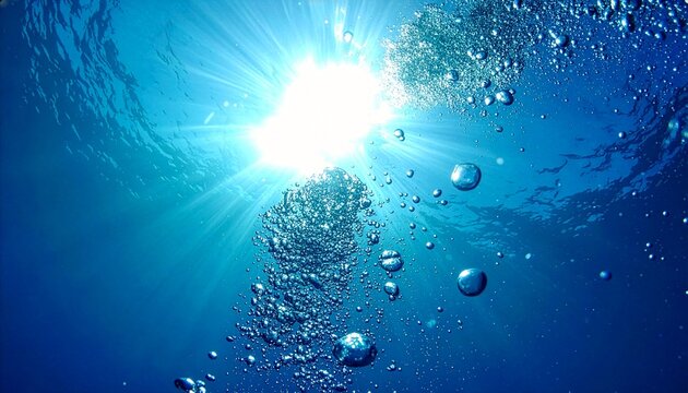 水底にまで届く強烈な太陽光が気泡の一粒一粒を照らし出す、躍動感あふれるコバルトブルーの水中写真
