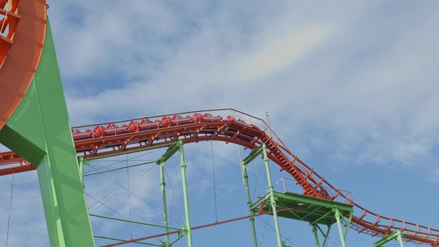 Orange Roller Coaster Train on Steep Incline