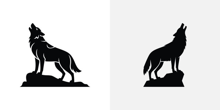 Black silhouette of two howling wolves on rocks wolf