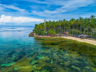 Obraz premium The beautiful aerial view of the morning on the beach with blue sea water in Kaur, Bengkulu, Indonesia