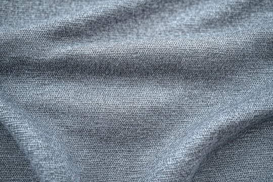 soft gray knitted fabric with fine stitch texture and gentle folds conveying cozy calm