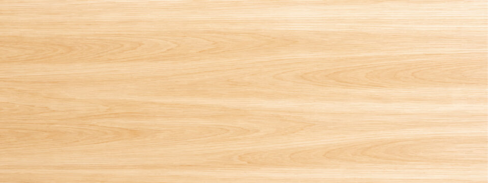 Abstract a detailed view of a light-colored wood surface, showcasing the natural grain and texture. This photo encapsulates the warm aesthetic and versatility of this natural material.