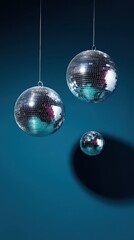 Sparkling disco mirror balls hanging in a dark nightclub reflecting colorful party lights for nightlife event promotion with medium orchid and turquoise accents