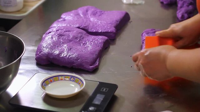 Ube cheese pandesal being prepared for baking