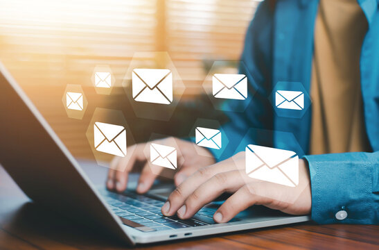 Email communication concept with multiple message icons over laptop workspace, digital marketing campaign, inbox management, online messaging system, business communication, data exchange, modern