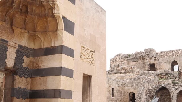 Detailed view of traditional Ablaq stone masonry on a historic building in Aleppo, Syria. Beautiful Islamic architectural decoration and ancient masonry craftsmanship