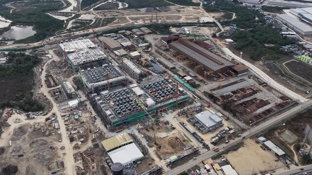 Aerial drone video of Data Centre QHI01 hyperscale campus construction in Chonburi, Thailand, within the Eastern Economic Corridor, showing large scale cloud computing, AI infrastructure, and