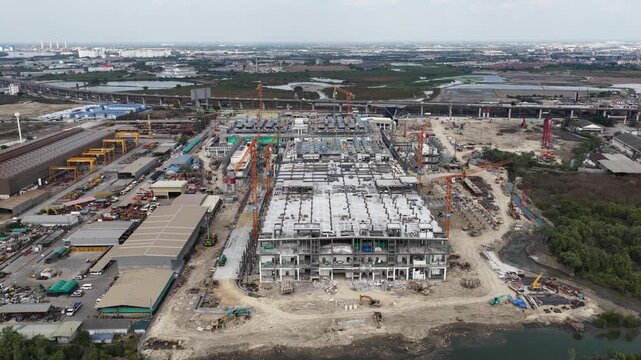 Aerial drone video of Data Centre QHI01 hyperscale campus construction in Chonburi, Thailand, within the Eastern Economic Corridor, showing large scale cloud computing, AI infrastructure, and