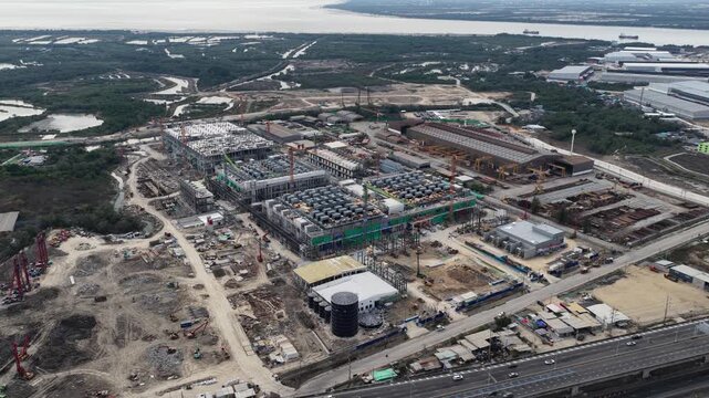 Aerial drone video of Data Centre QHI01 hyperscale campus construction in Chonburi, Thailand, within the Eastern Economic Corridor, showing large scale cloud computing, AI infrastructure, and
