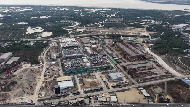 Aerial drone video of Data Centre QHI01 hyperscale campus construction in Chonburi, Thailand, within the Eastern Economic Corridor, showing large scale cloud computing, AI infrastructure, and