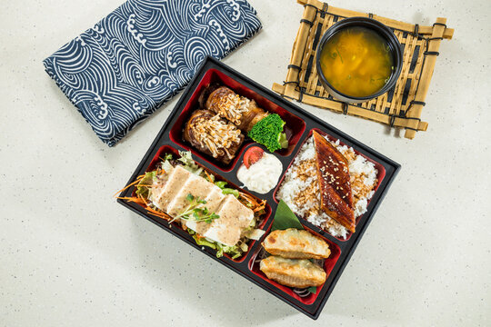 assorted japanese bento with eel and sides
