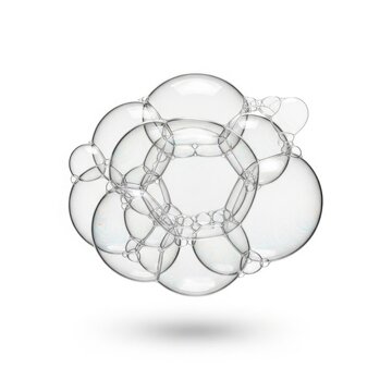 Cluster of transparent soap bubbles with reflections on white background
