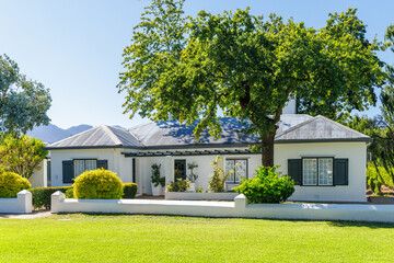 Fototapeta premium Winery house surrounded by lush greenery