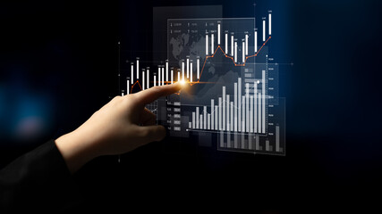 A person hand interacts with digital graphs and charts illustrating data analytics in a...