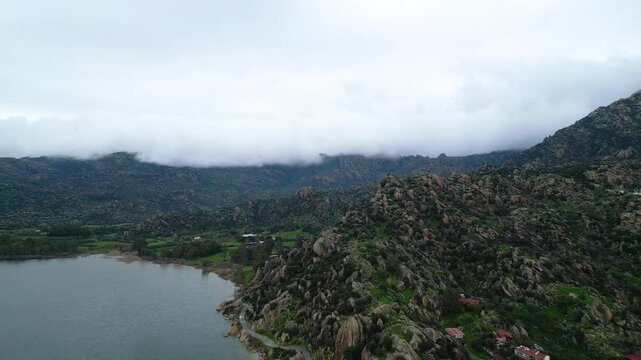 Drone footage captures the stunning natural beauty and historical significance of Bafa Lake Nature Park in Turkey. The aerial perspective showcases the serene waters of Bafa Lake nestled amidst rugged