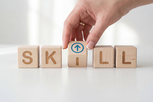 Woman holding a wooden block with an upward blue arrow next to cubes spelling out skill