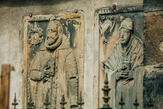 Seventeenth-century epitaph of two noble townspeople on stone in church, Europe