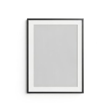 Vertical black frame with white mat on a plain white wall