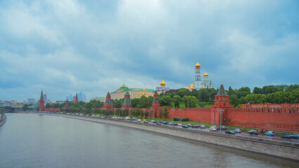 Fototapeta premium Panoramic view of Moscow Kremlin and Moskva River in cloudy weather with copy space