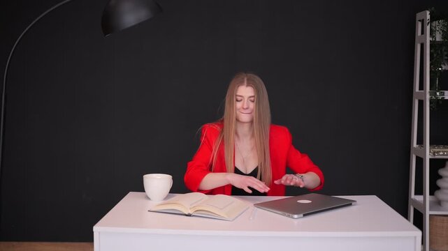 Overjoyed businesswoman finishing work and celebrating success