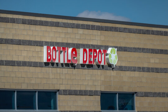 Calgary, Alberta, Canada. April 13, 2026. Exterior view of a retail building featuring a red "Bottle Depot" sign with a green recycling logo.