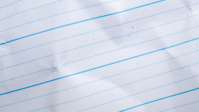Blank crumpled lined notebook paper texture background stop motion
