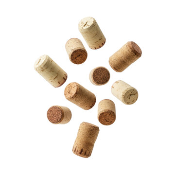 Natural wine corks with porous textures floating in a dynamic scattered formation against a white studio background, concept of premium winery branding