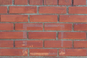 Naklejka premium Clean red brick wall texture with even mortar lines, uniform courses, warm terracotta tones, sharp edges, ideal background for architecture, interior design, graphic projects