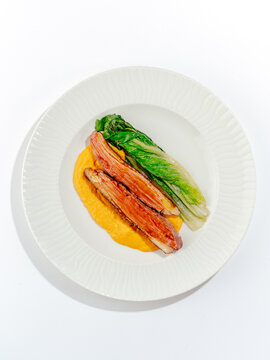 grilled duck breast with sauce and side dish