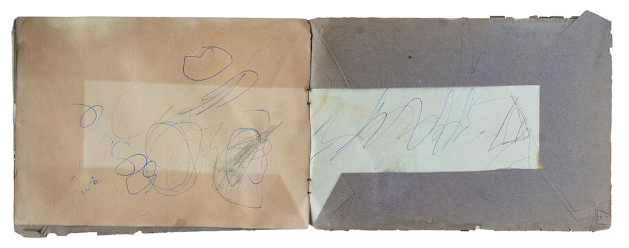 Vintage open landscape notebook with gray covers with  pencil scribbles on aged paper pages