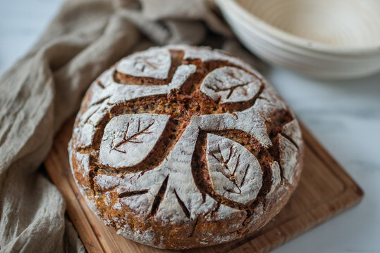 Freshly baked rye bread on wooden board. Homemade sourdough bread
