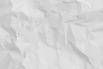 Obraz premium Top view of white crumpled paper texture background,Macro,Close-up shot of white wrinkled and crumpled paper texture background. High resolution texture of folded paper with shadows and highlights,