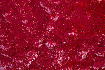 Homemade berry spread. Fresh strawberry jam with seeds. Artisanstyle strawberry preserve with spoon marks. Handcrafted strawberry jam featuring visible seeds and glossy texture © beholdereye