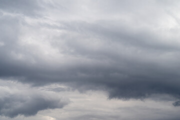 Fototapeta premium Serene stormy skies. Calm clouds with gray gradients. Quiet atmospheric layers portraying impending weather. Tranquil gray clouds suggestive of approaching stormy conditions