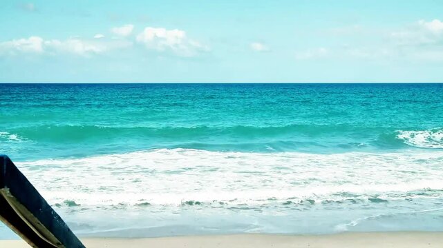 View of the Mediterranean Sea with small waves arriving on the beach. The video was shot in the seaside village of Rodia, near Messina, Sicily, in Southern Italy