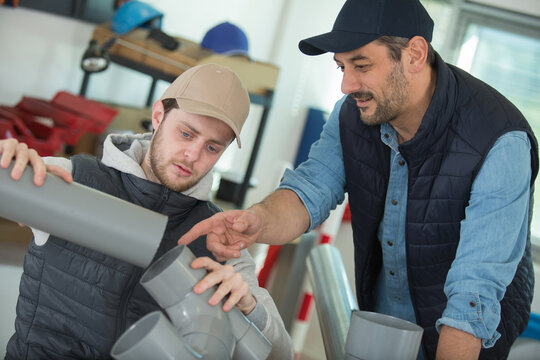 a young plumber and manager