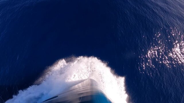 Foaming waves from the bow of a cruise ship cutting through waters of Southern Ocean