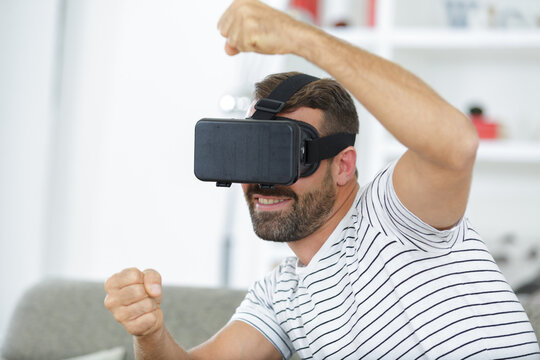 man wearing virtual reality in modern coworking studio