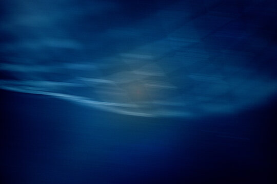 Deep Blue Water Abstract Background With Soft Light, Gentle Wave Motion and Calm Mood, blurred overlay film grain texture	
