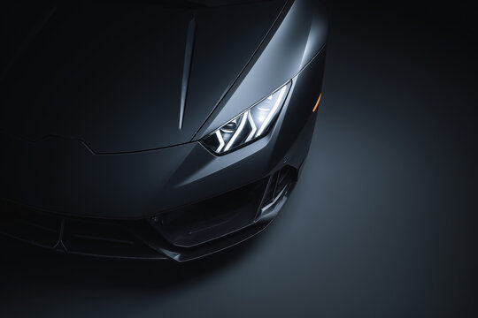 Sports car front detail sleek black automotive headlight design