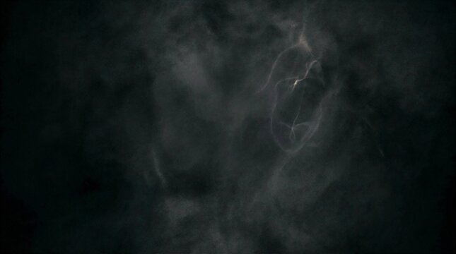 Mysterious dark silhouette of a person with flowing hair against a shadowy backdrop evoking intrigue and depth